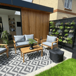 a living wall with an entertainment space and outdoor seating
